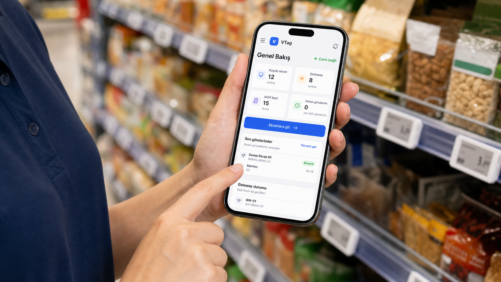 Supermarket employee using the VyTag Cloud Software mobile dashboard to manage shelf labels