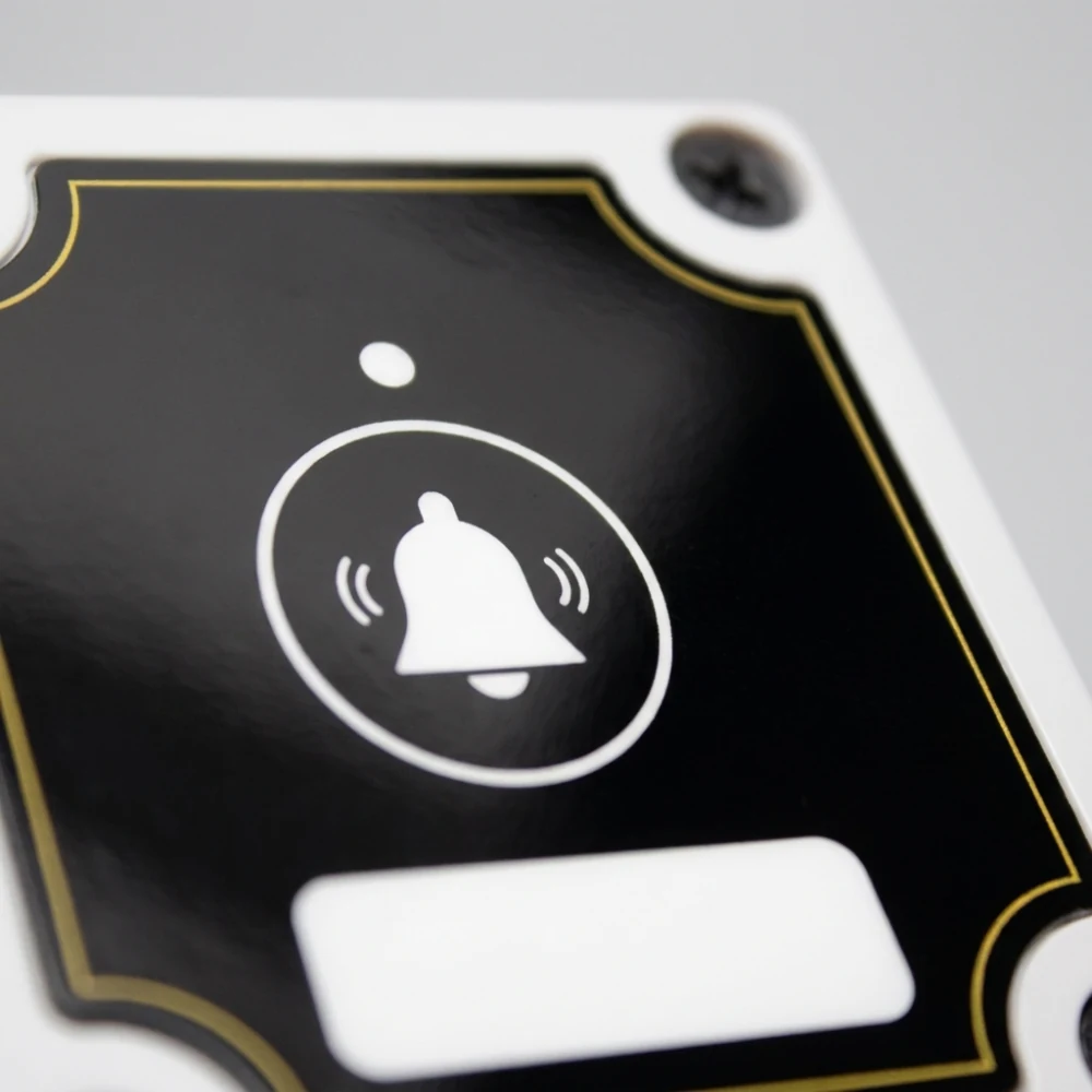 The Vycall A100 outdoor call button — a close-up of the membrane-covered key